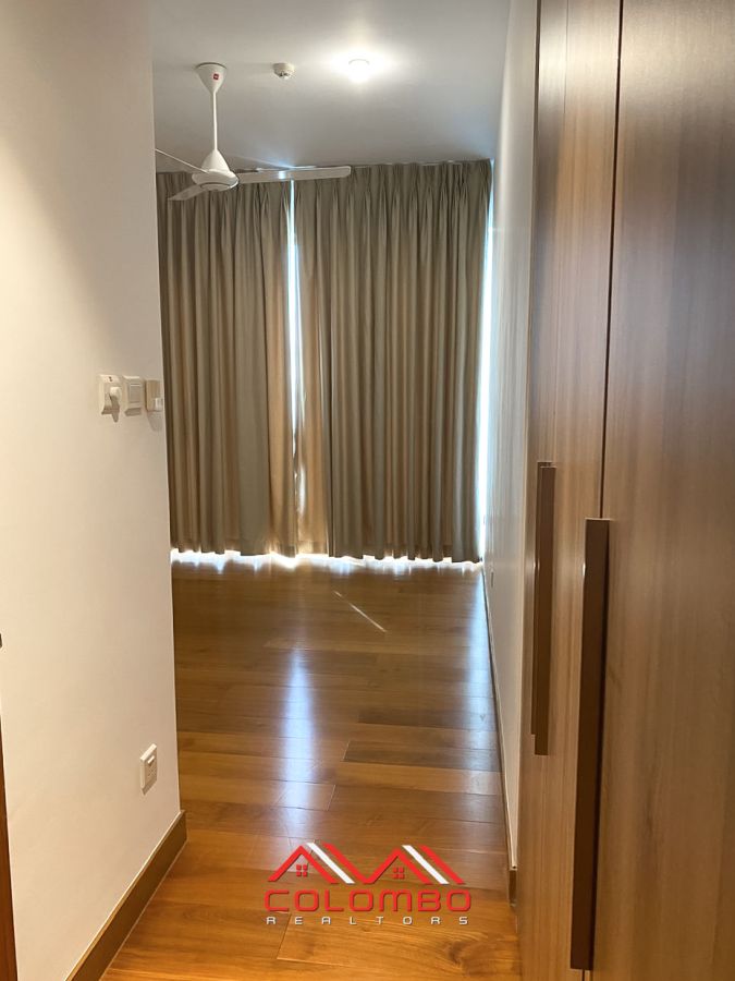 Room with curtains and wardrobe of Shangri-La One Galle Face Residence East Tower Apartment for Rent or Lease in Colombo 2 by Colombo Realtors