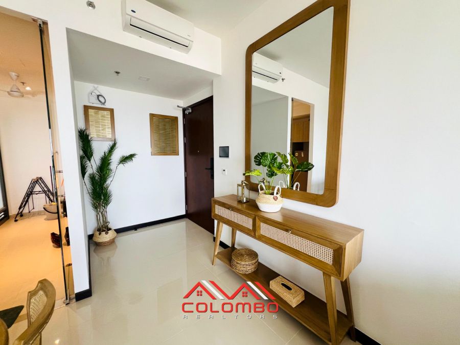 Living Room with mirror of Tri-Zen Tower 1 Apartment for Rent or Lease in Colombo 2 by Colombo Realtors